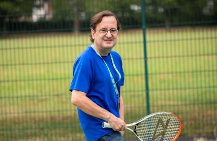 Cllr Osborn playing tennis at Byron Park's refurbished tennis courts