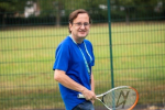 Cllr Osborn playing tennis at Byron Park's refurbished tennis courts