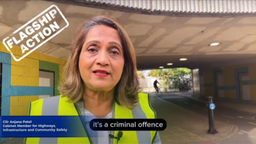 A still of Cllr Patel from the social media video. She is wearing a high viz jacket and standing near an underpass known for ASB issues.